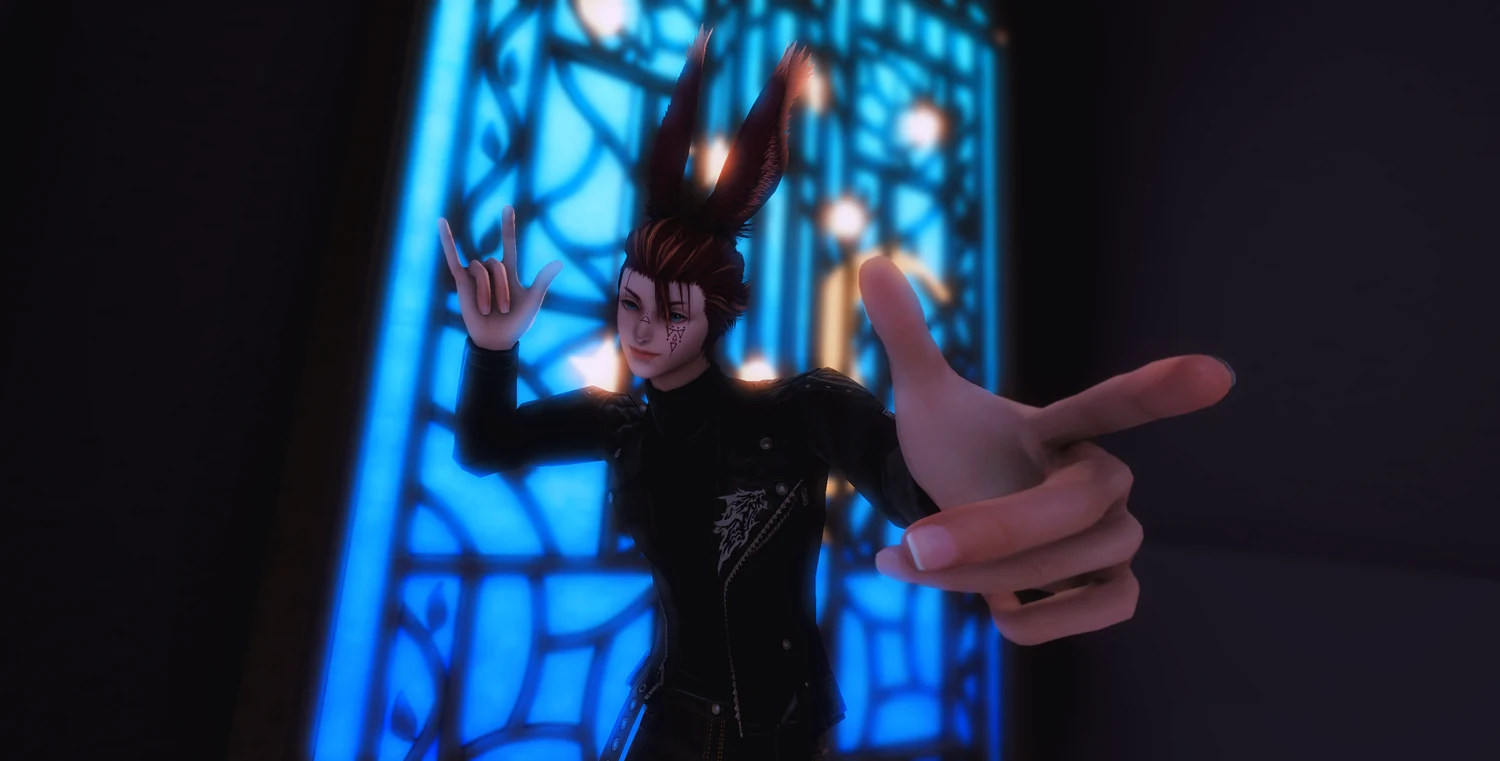 Nicky Starfall making a heart and an I-love-you sign with his hands
